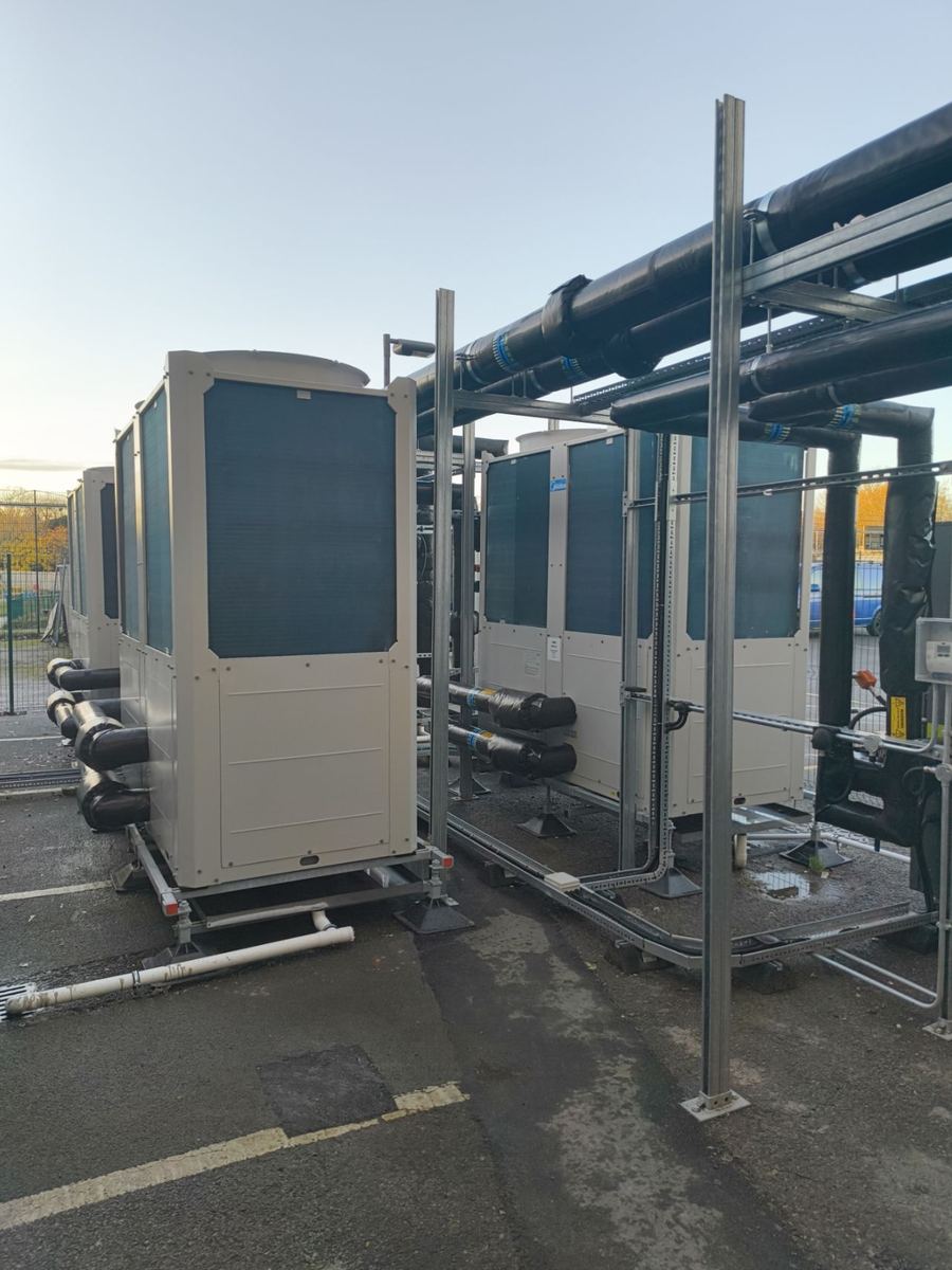 External packaged plantroom compound with heat pumps and pipework