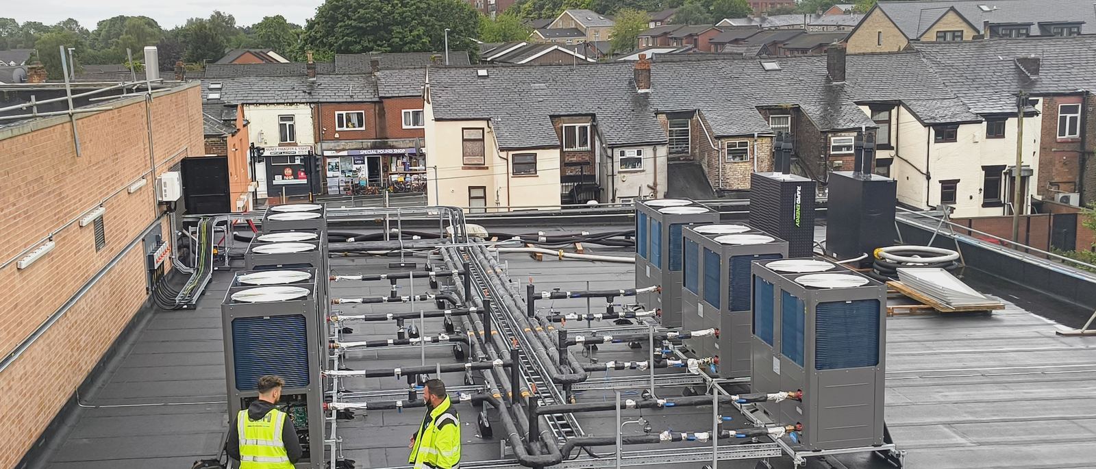 Jupiter engineers commissioning an air source heat pump array on a roof